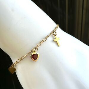 Avon  gold tone heart  cross anchor charm bracelet